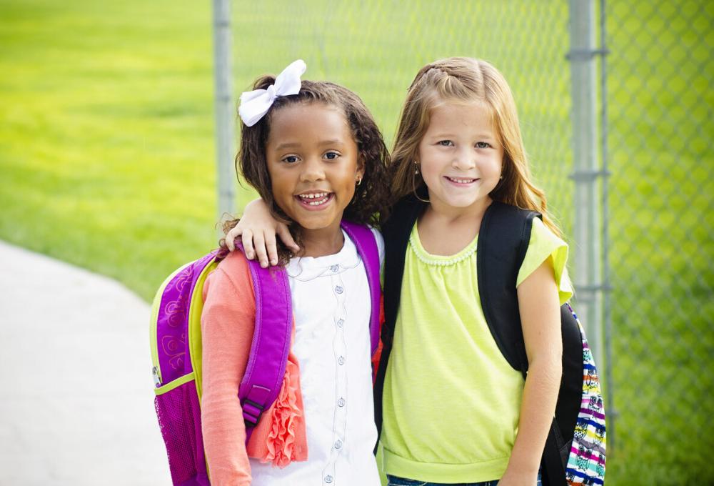 two young girls smiling before school