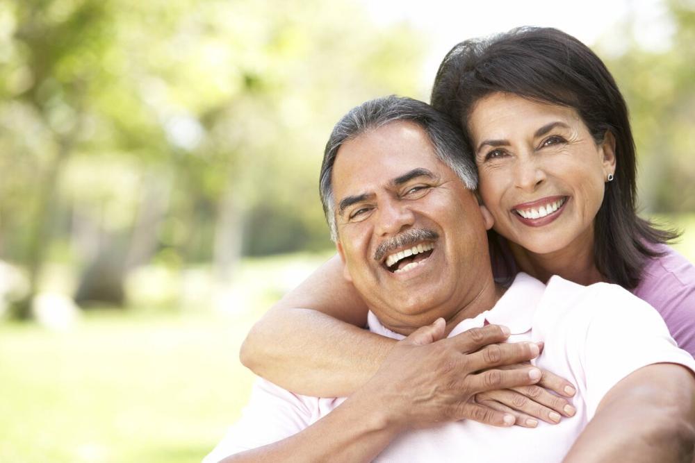 older man and woman smiling in Urbandale park