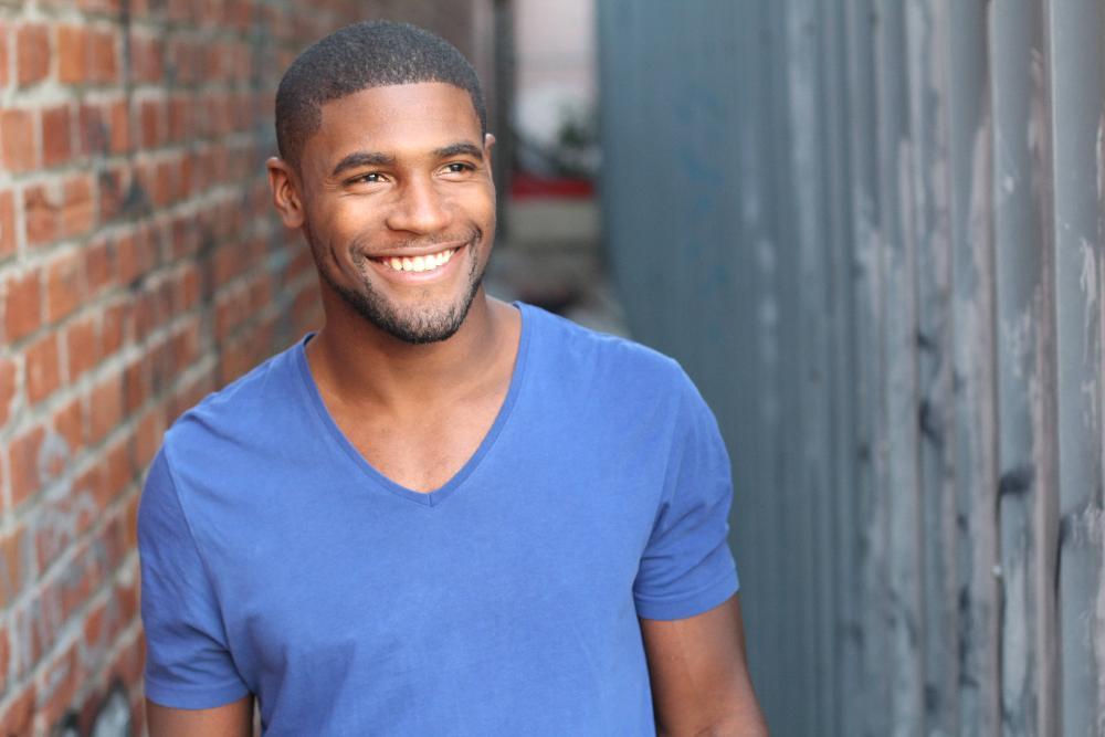 man smiling after getting porcelain veneers in urbandale
