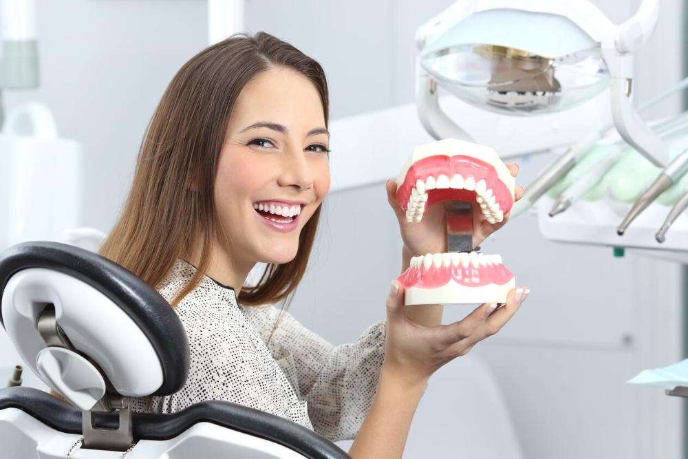 woman smiling in dental chair in Urbandale