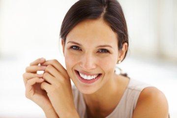 woman smiling after using invisalign in Johnstson