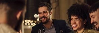 Man and woman smiling at a dinner in Urbandale