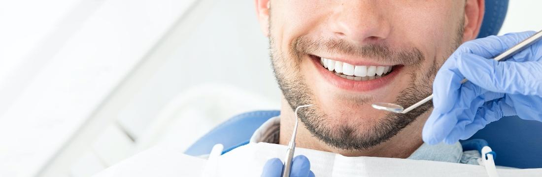 close up of man's mouth during dental cleaning in johnston