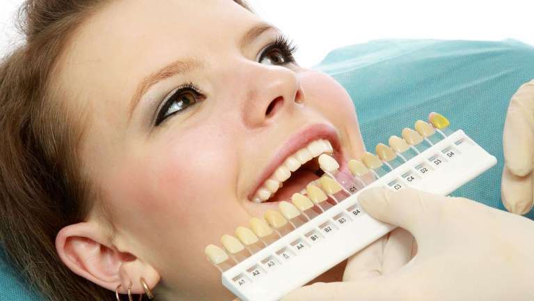 woman getting teeth whitened in Urbandale IA