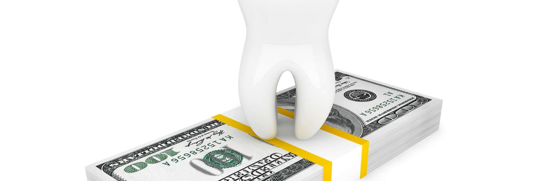 tooth sitting on top of a stack of money