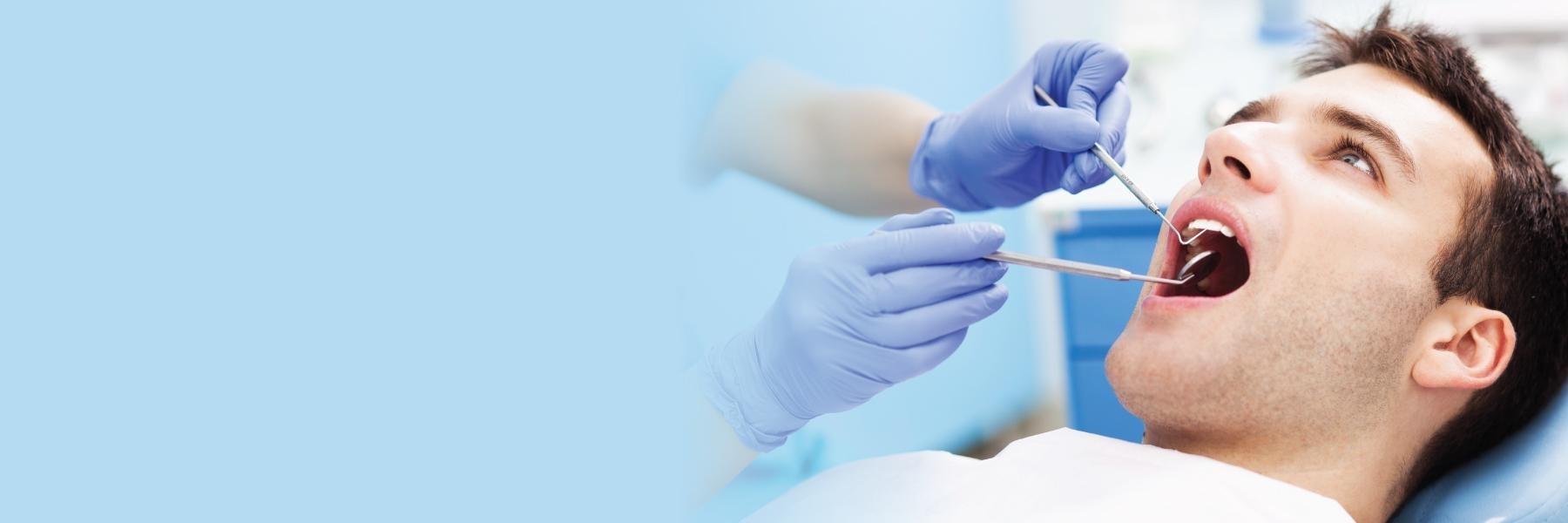 man getting periodontal check in johnston ia