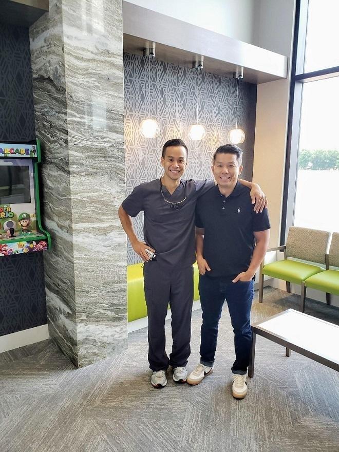The best patient standing with his dentist Dr. Trung in Urbandale and Johnston Iowa